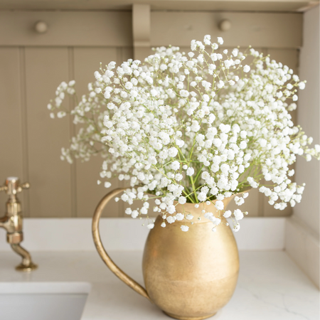 Antique style dulled brass (almost golden) curvy handled jug. Perfect for displaying florals.
