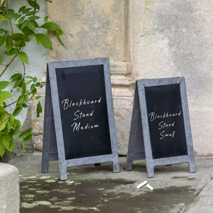Two charming table top blackboards wrapped in zinc style metal designed to look like A-frames.