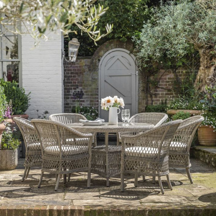 Open weave rattan dining sets, from 2 seater bistro sets to larger 6 seater sets. Comfortable semi-relaxed chairs with cushions and a perfectly round dining table to suit.