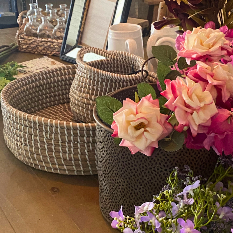 A selection of donated homeware baskets and flowers
